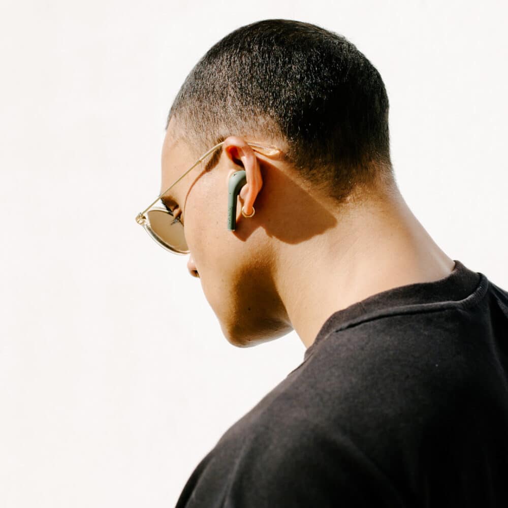 Defunc TRUE PLUS Black, man with earbuds in ears