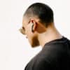 Defunc TRUE PLUS Black, man with earbuds in ears